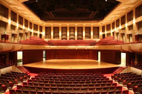 The inside of the Alys Stephens Theater with empty seats.